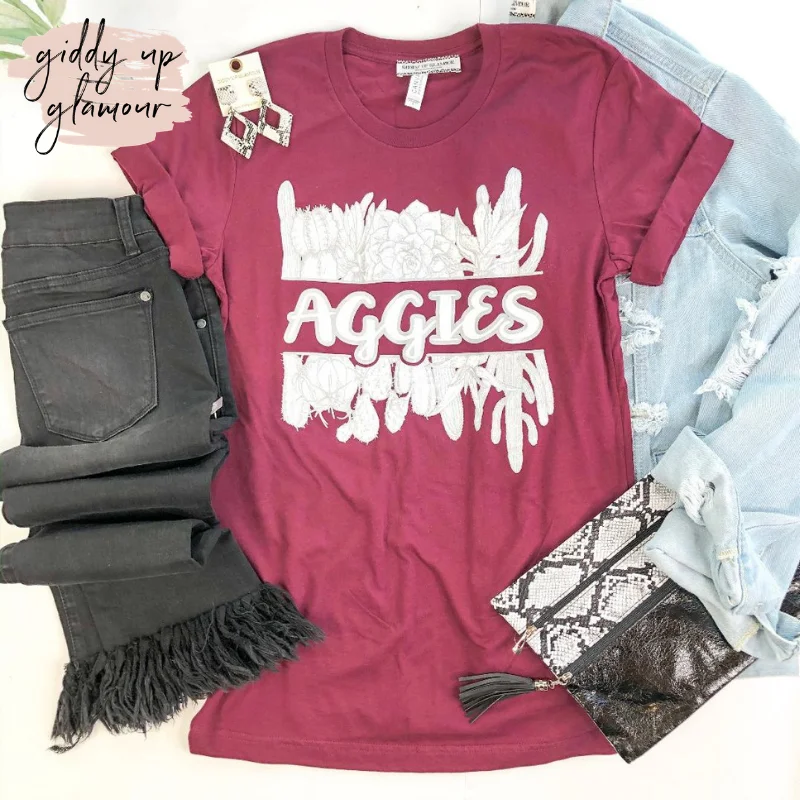 Trendsetter's Closet Last Chance Size 3XL | Aggie Game Day | Aggies in Cursive with Cactus Short Sleeve Tee Shirt in Maroon Trendsetter's Closet Last Chance Size 3XL | Aggie Game Day | Aggies in Cursive with Cactus Short Sleeve Tee Shirt in Maroon